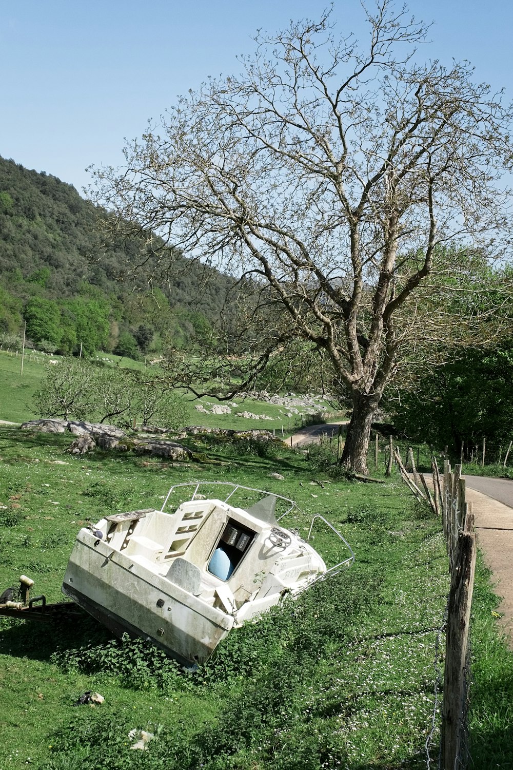 a boat sits on the side of a road