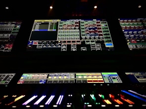 Close-up of a modern AV system setup with multiple screens and control panels.