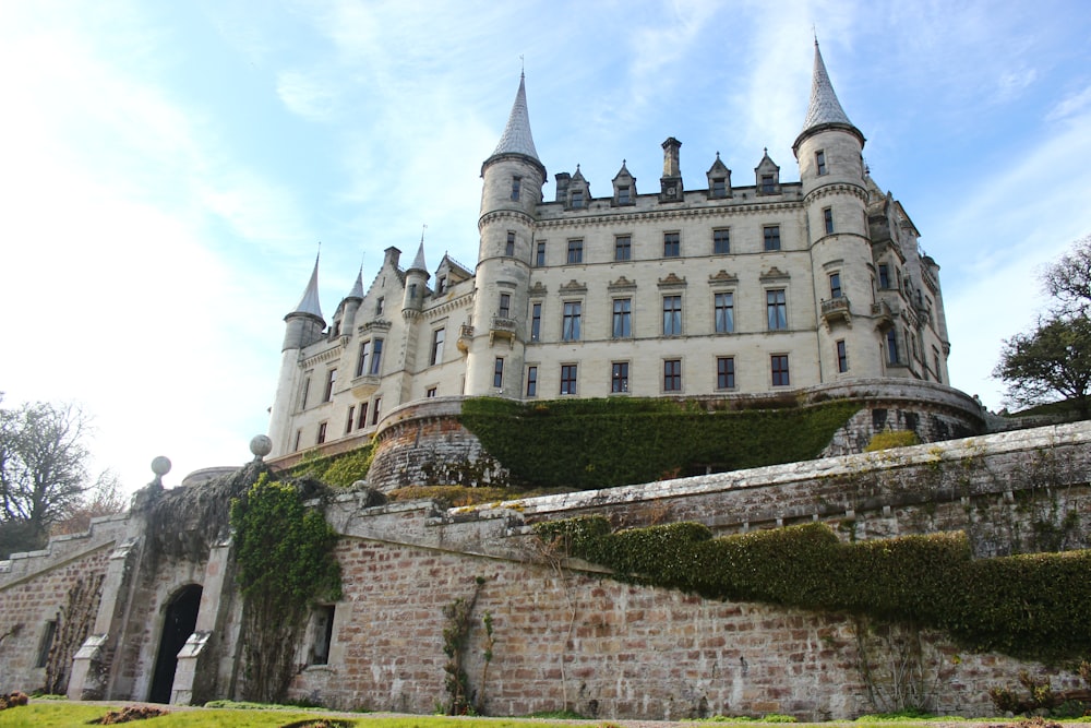 a large building with a stone wall