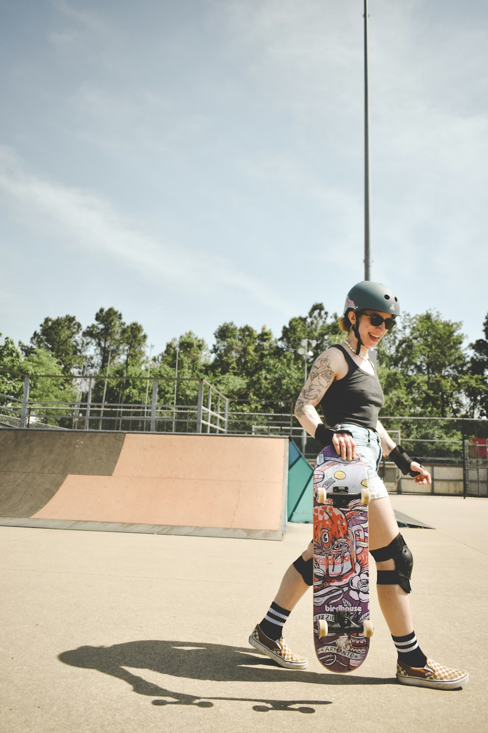 a person holding a skateboard