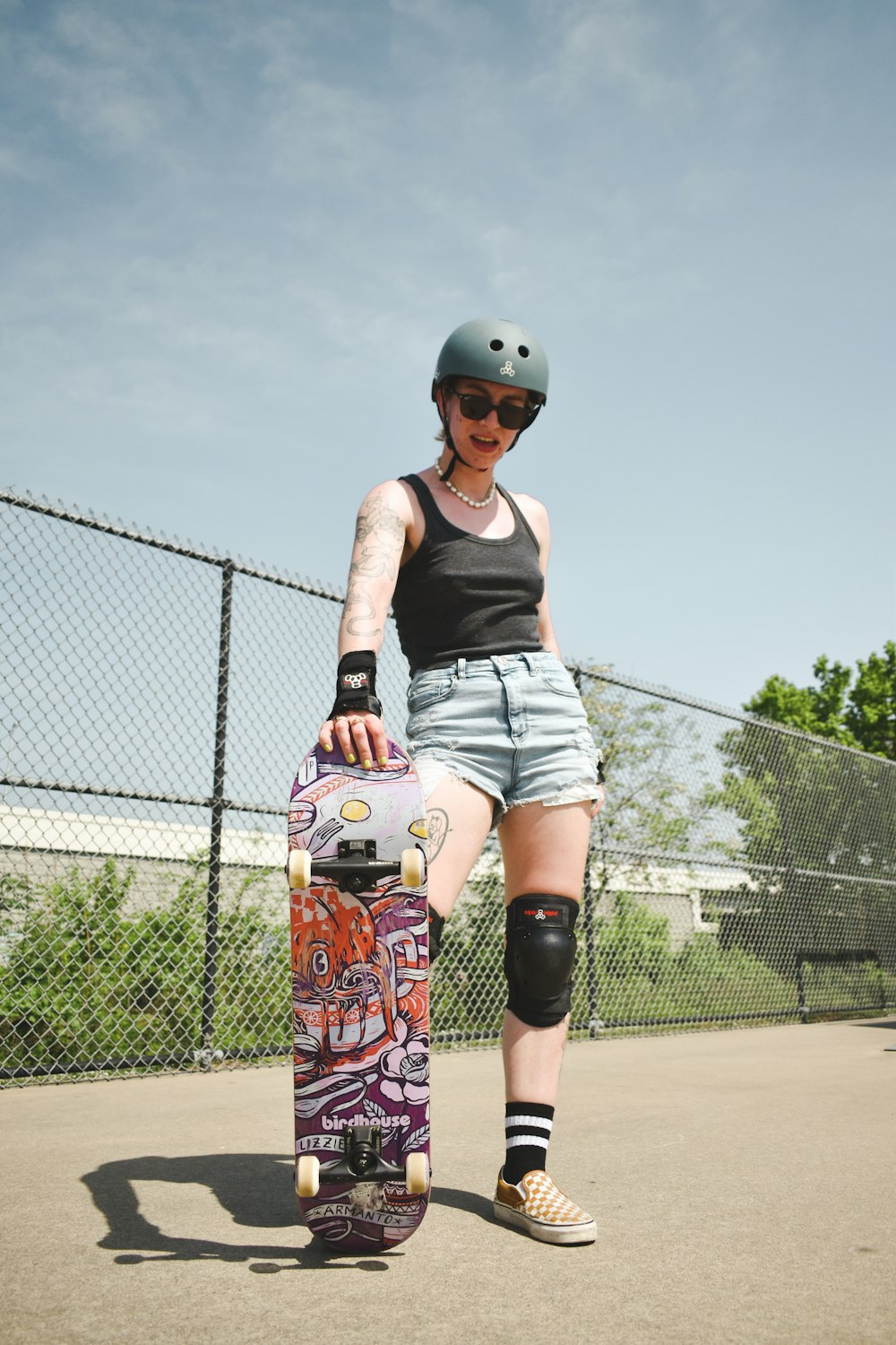 a person holding a skateboard