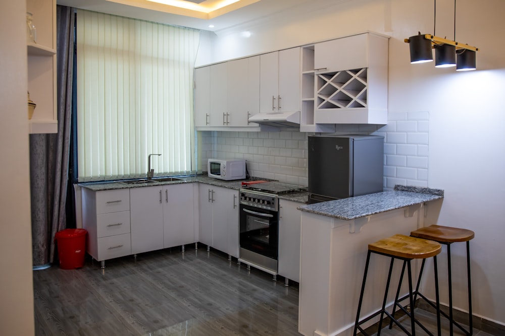 a kitchen with white cabinets