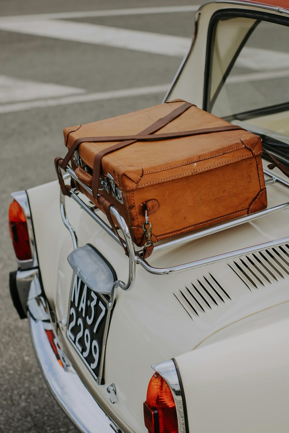 a suitcase on the back of a car