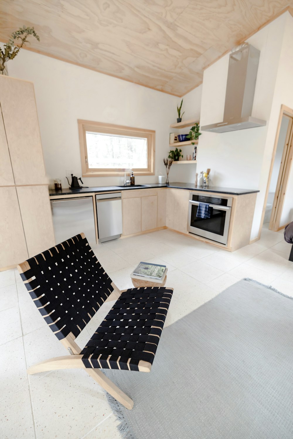 a kitchen with a rug