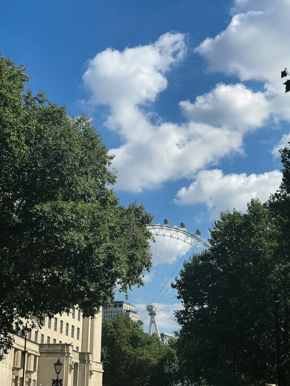 a bridge with trees and buildings