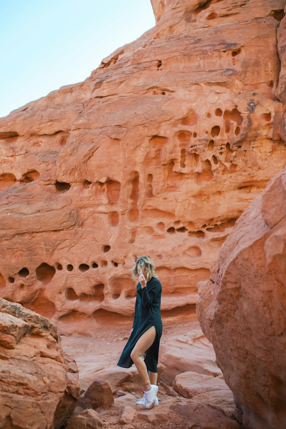a person posing in a canyon