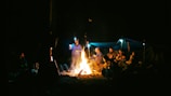 a group of people around a campfire