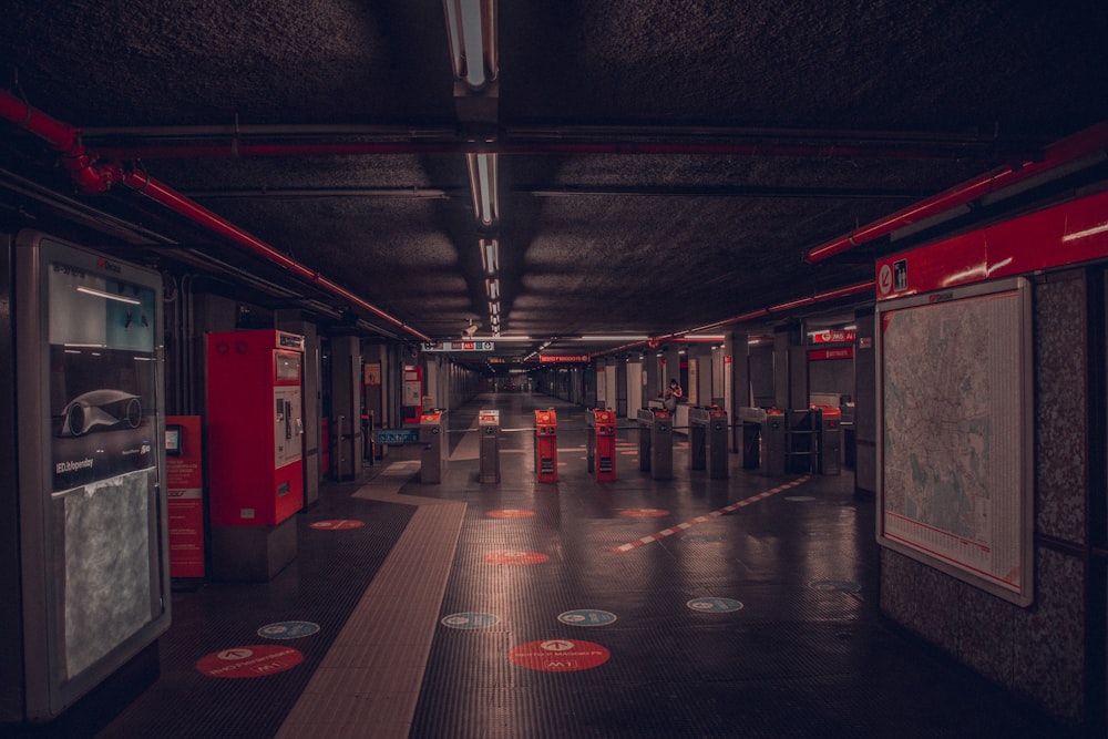 a long hallway with red lights