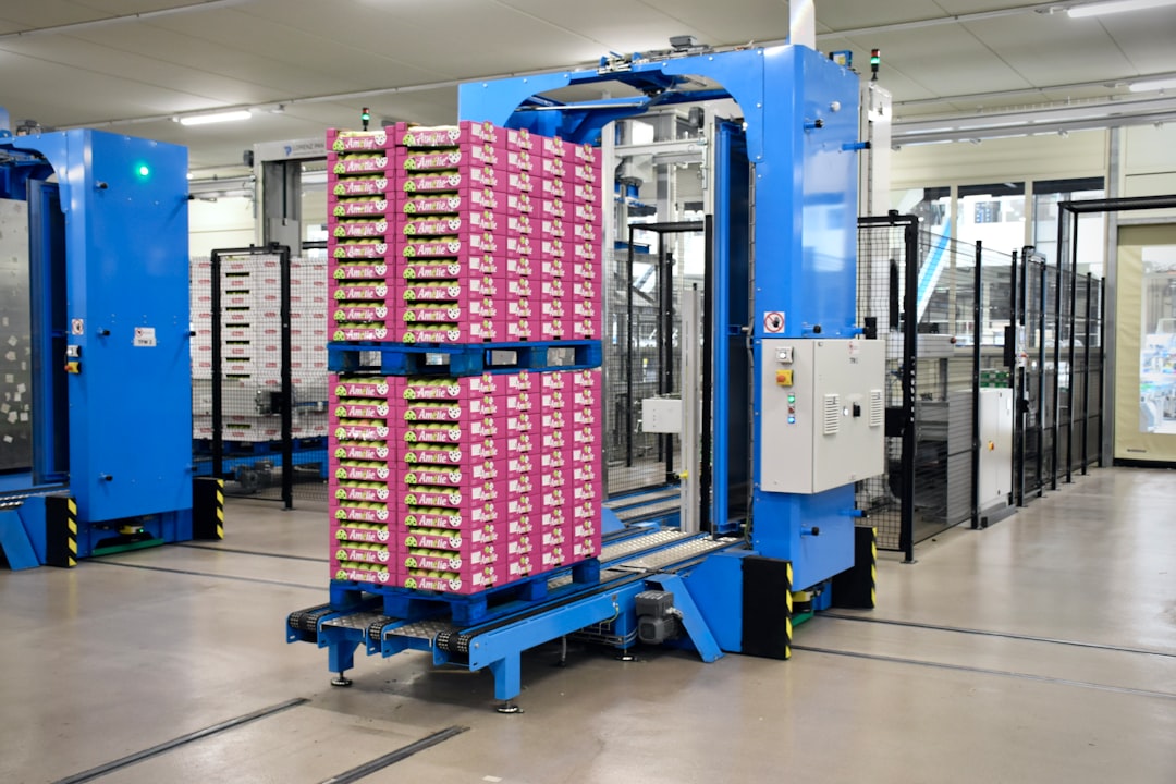 a large stack of boxes, Inside an apple processing company in northern Italy