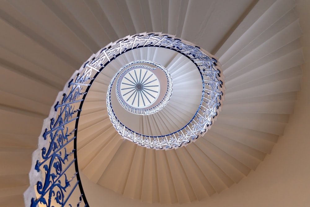 a spiral staircase with a blue and white design