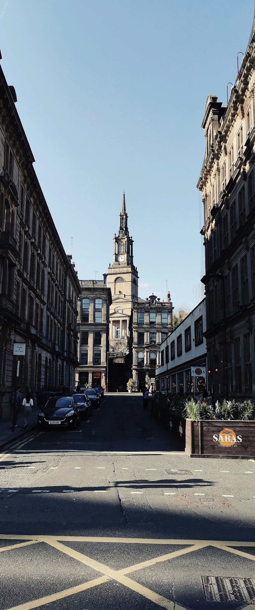 a street with cars and buildings on either side of it