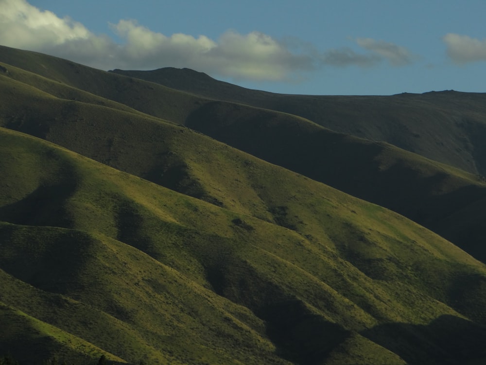 a green valley with hills