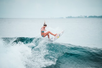 a man surfing on the waves