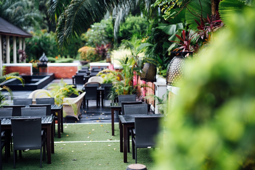 a patio with tables and chairs