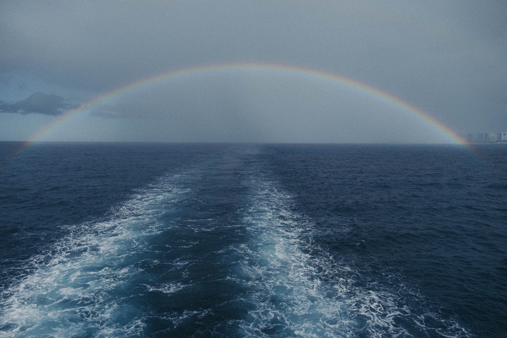 a rainbow over the ocean