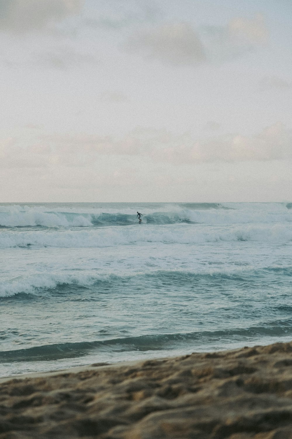 a person surfing in the sea