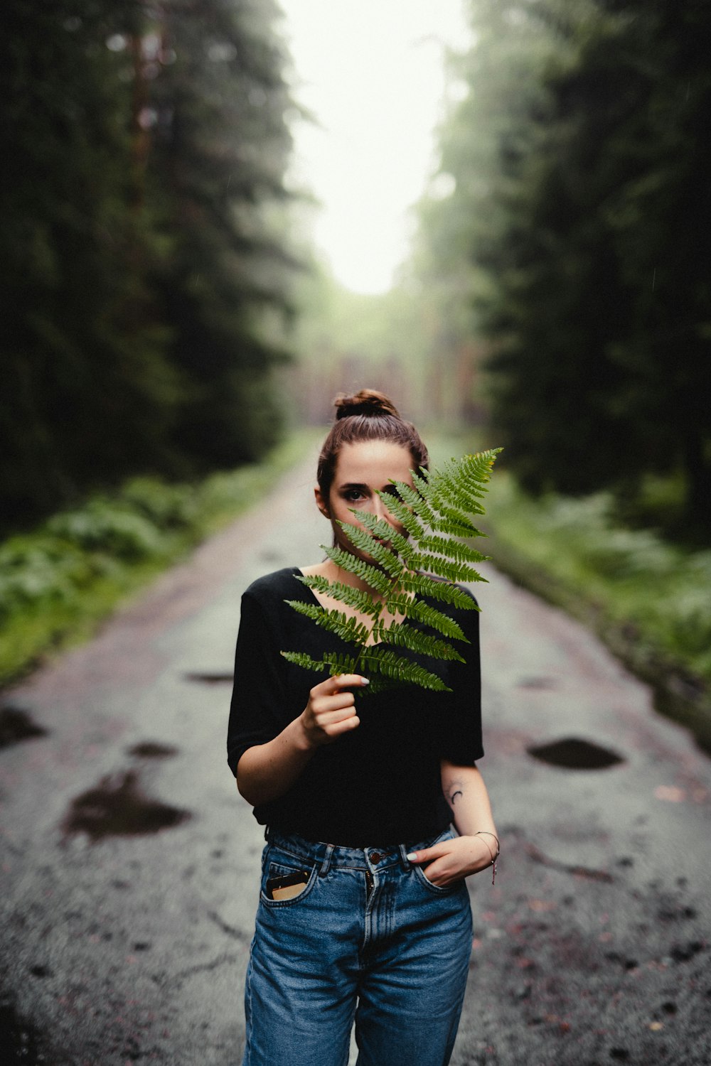 a person holding a pine tree