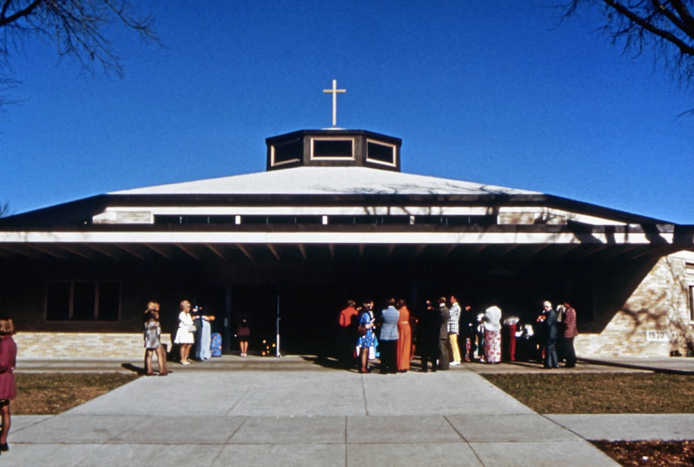 a group of people standing outside a building