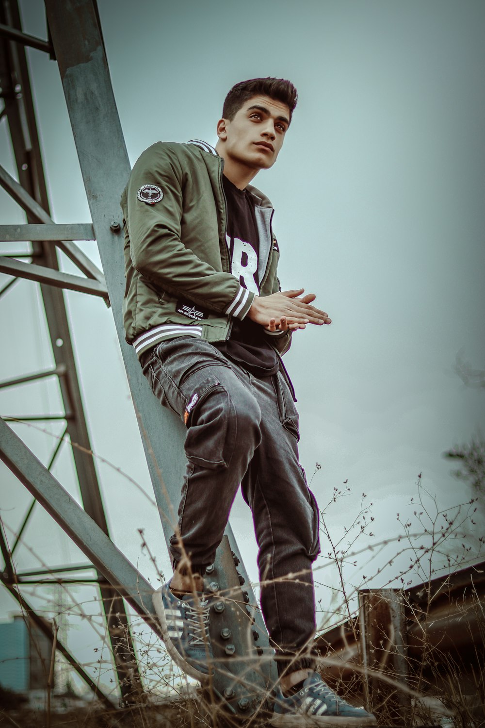 a man standing on a metal structure