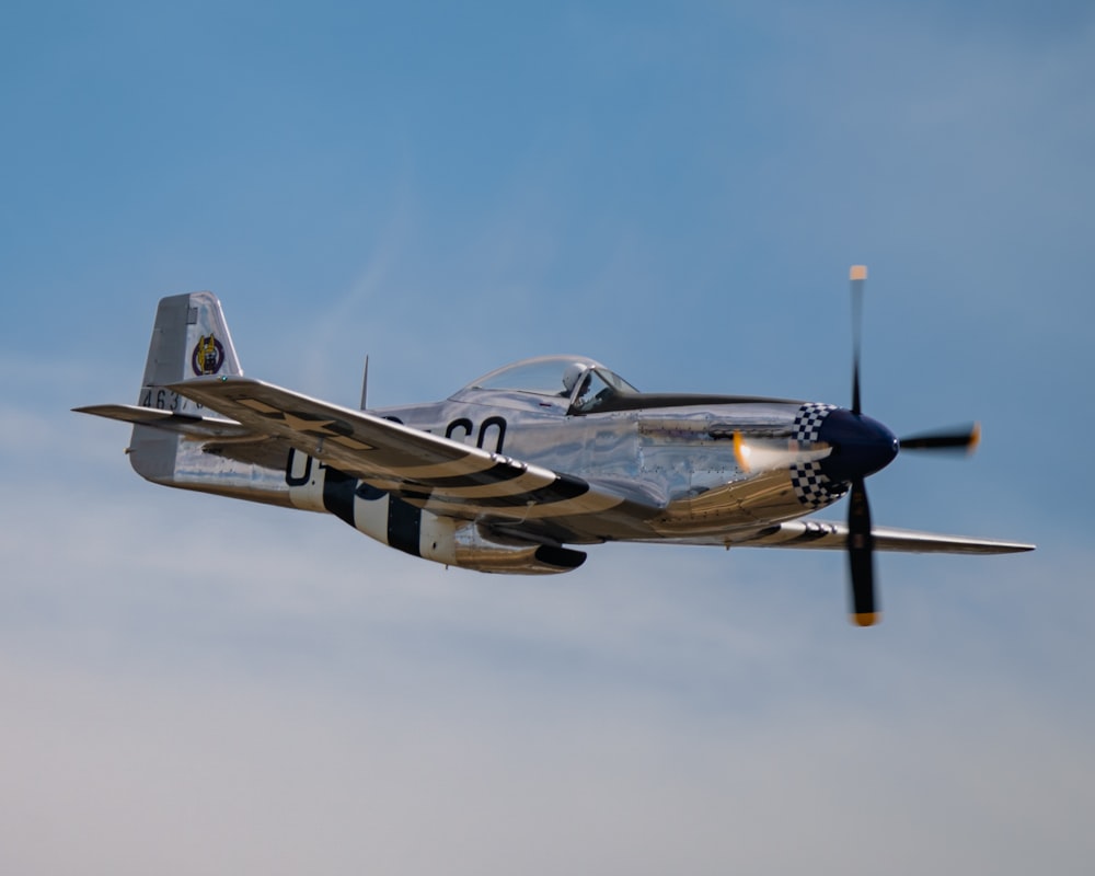 a small airplane flying in the sky