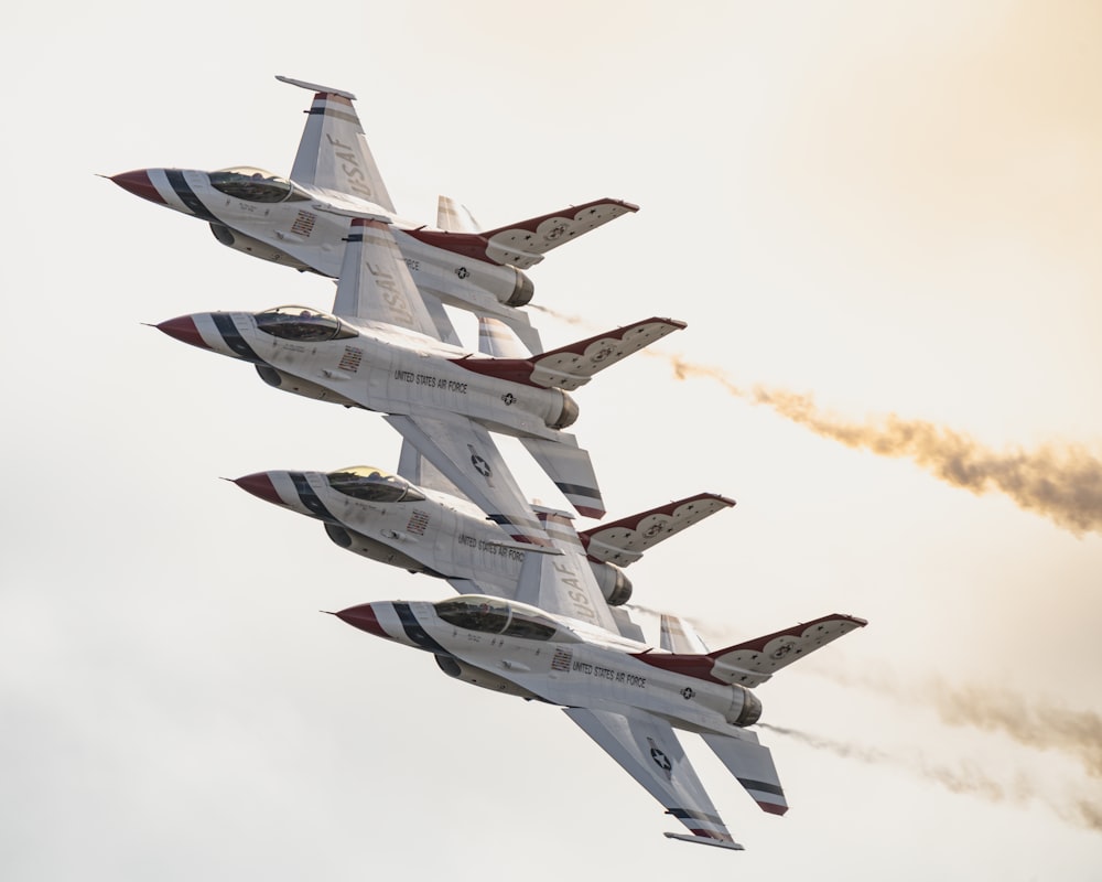 a group of jets flying in formation