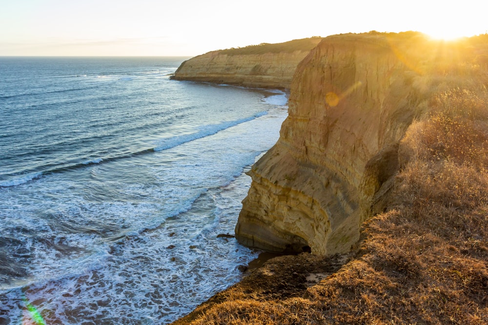 a cliff next to the ocean