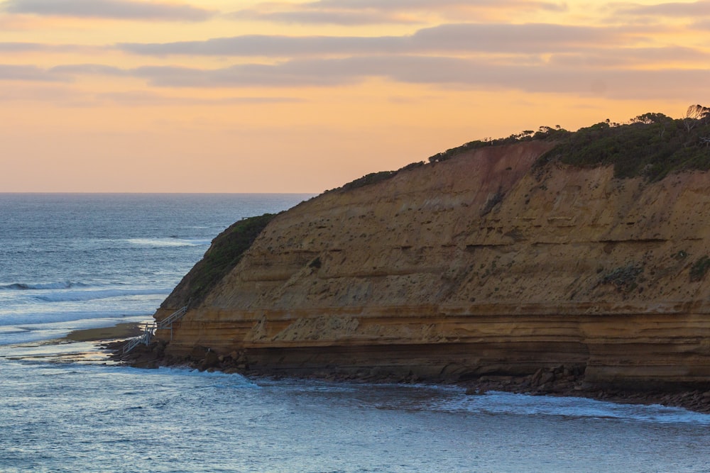 a cliff next to the ocean