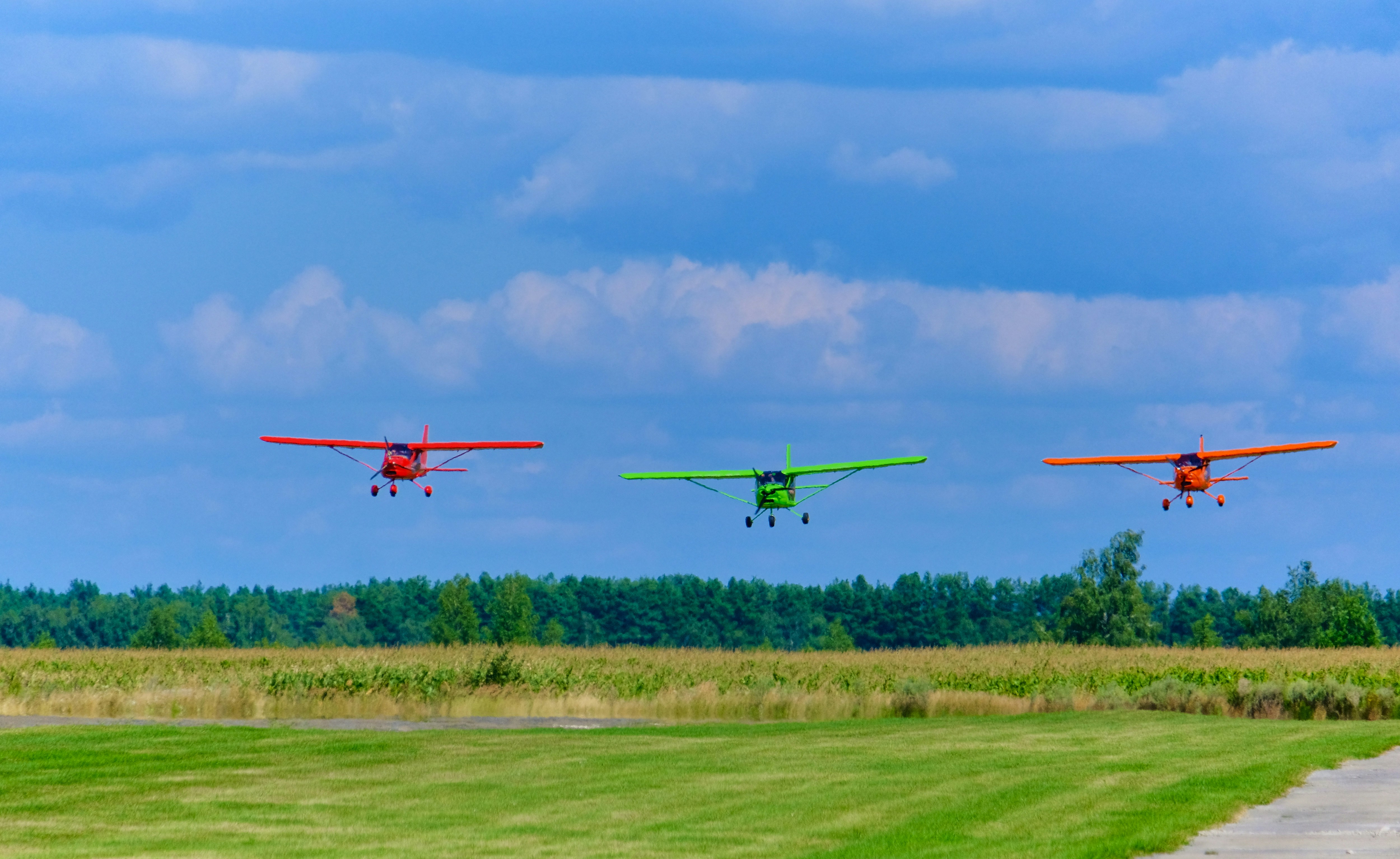 a group of airplanes fly through the air