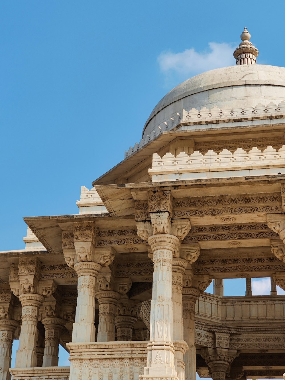 a building with columns and a blue sky