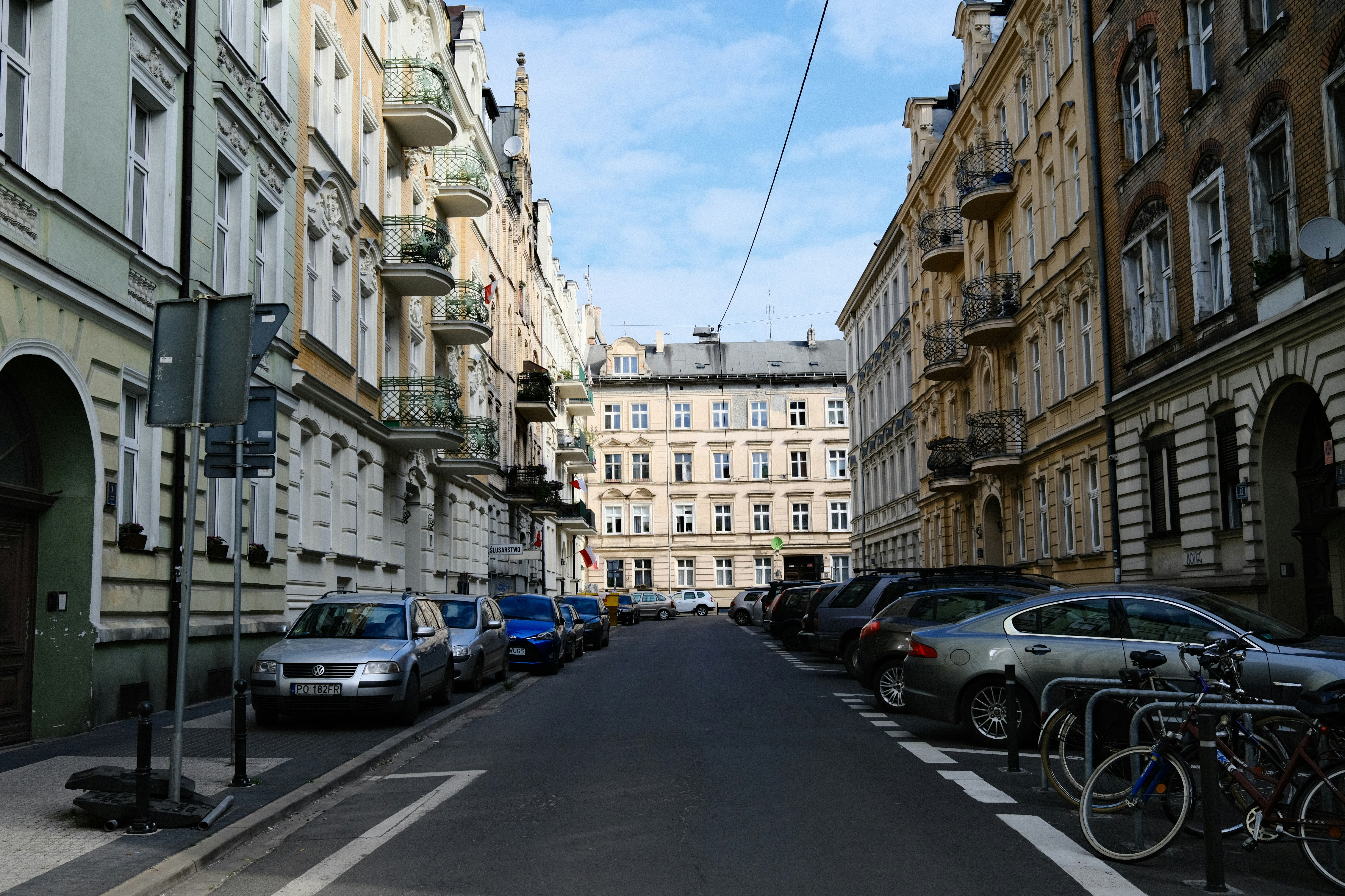a street with cars and buildings on either side of it