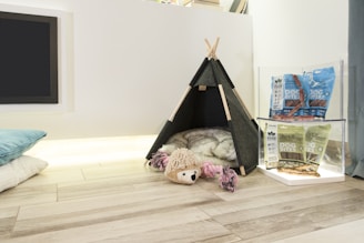 a toy house on a hardwood floor