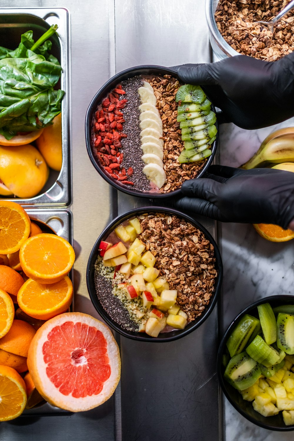 a person holding a knife over a table full of food