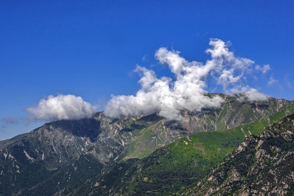 a mountain with clouds