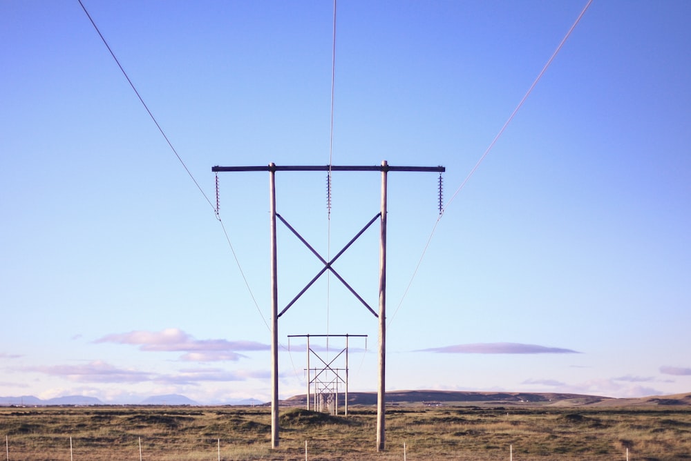 a group of power lines in a field