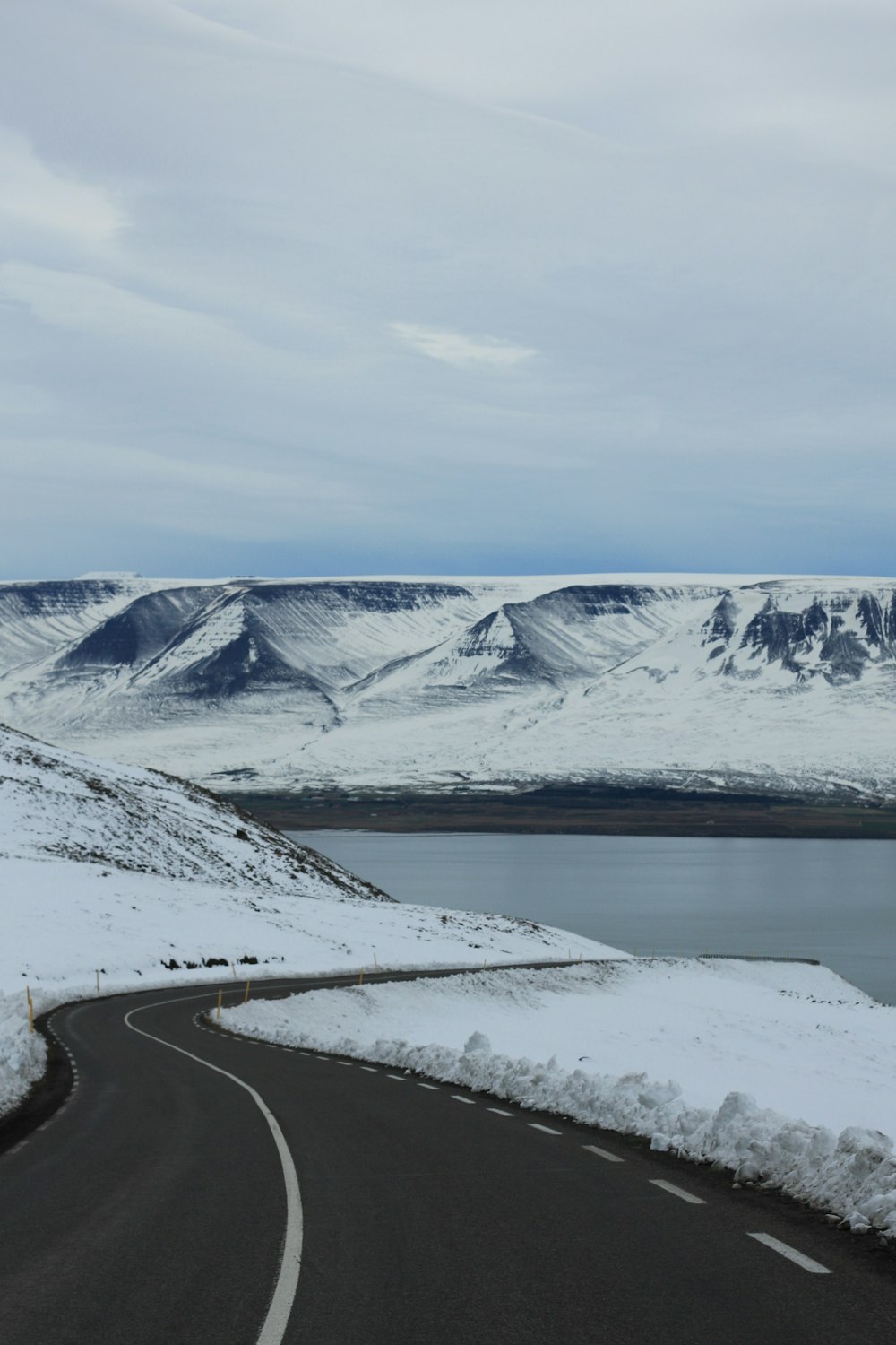 a road with snow on the side