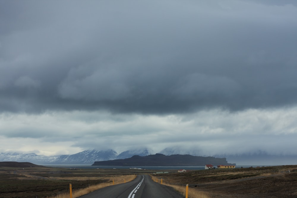 a road with mountains in the background