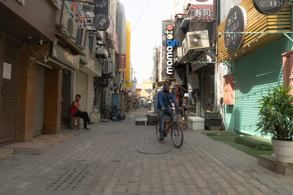 a person riding a bicycle down a street