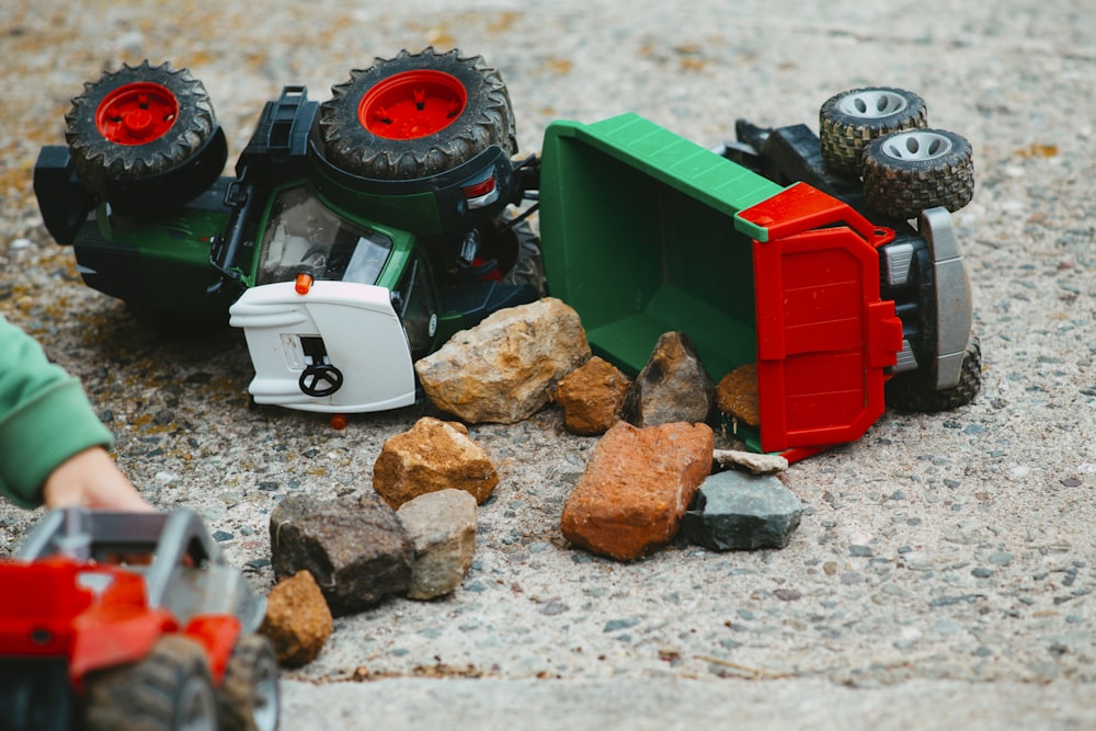 a toy tractor and rocks