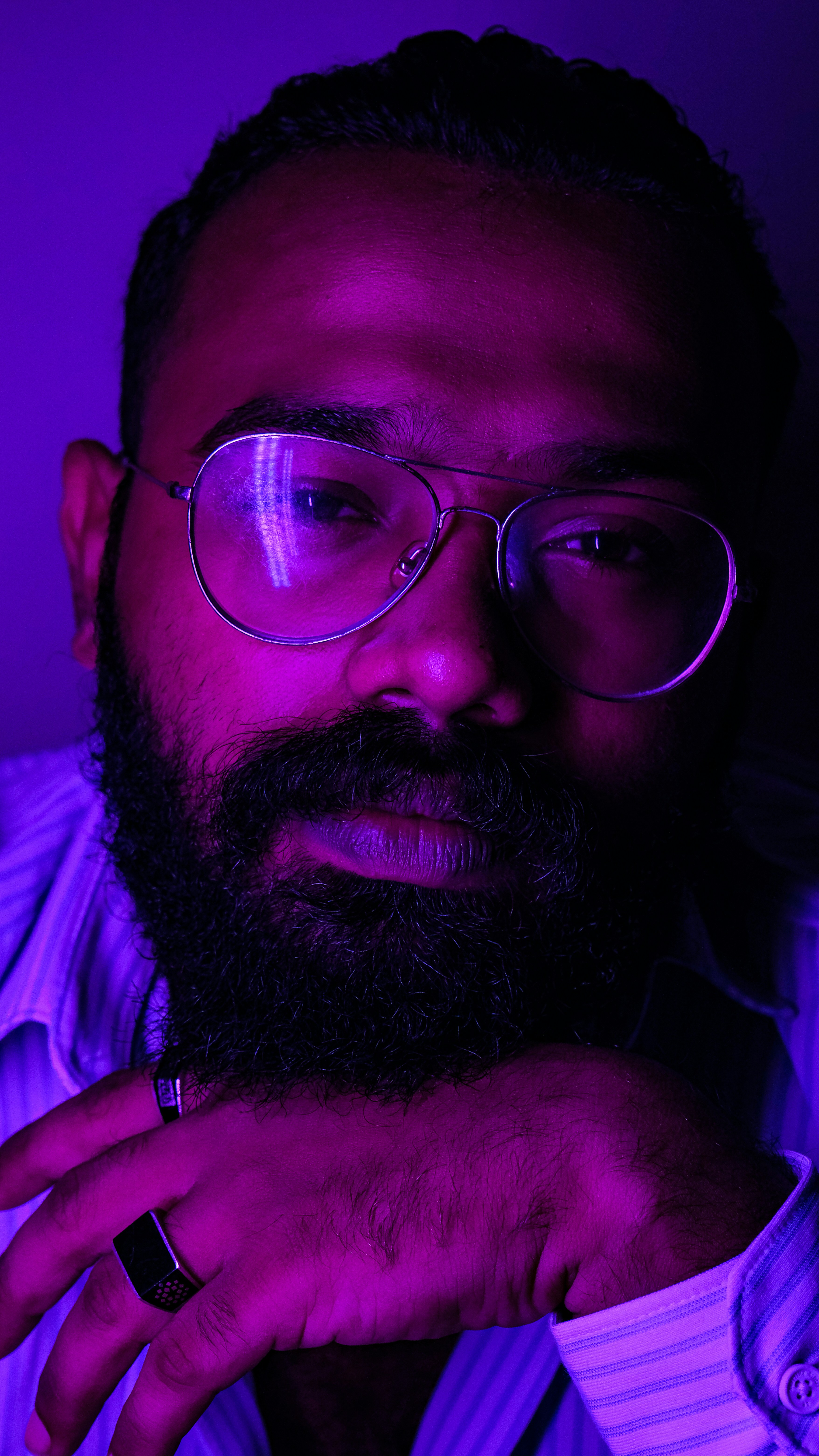 a man with a beard and glasses