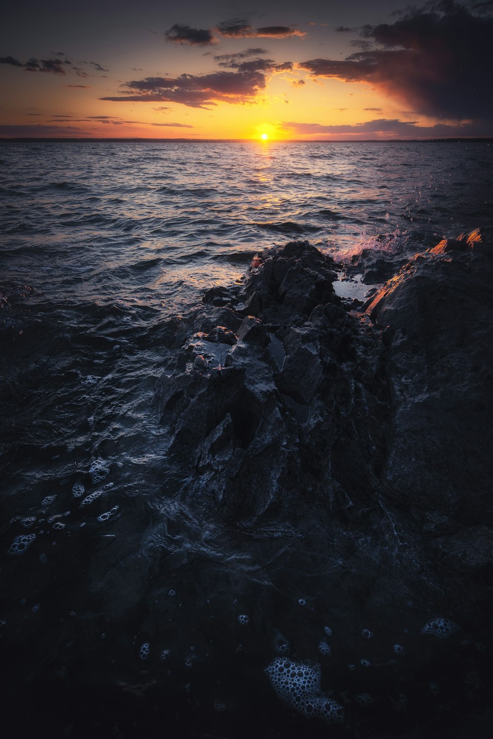 a sunset over a body of water