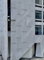a white rectangular building with windows
