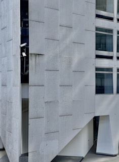 a white rectangular building with windows