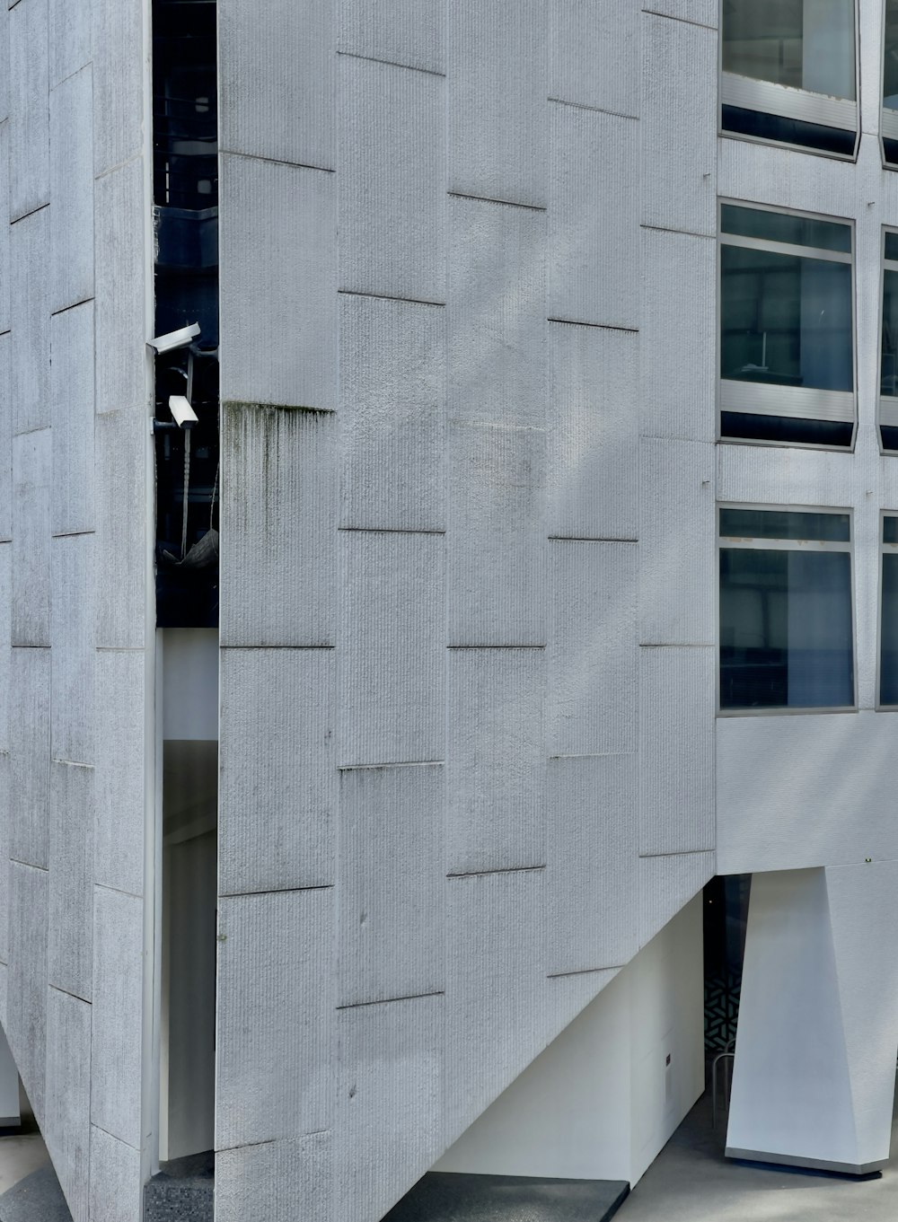 a white rectangular building with windows