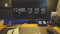 Close-up of a countdown timer displaying days left to exams on a cozy study desk.