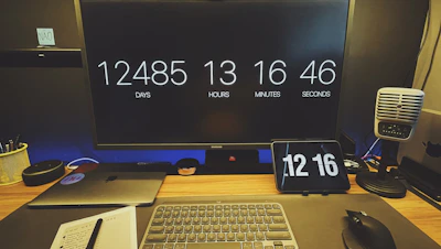 Close-up of a countdown timer displaying days left to exams on a cozy study desk.