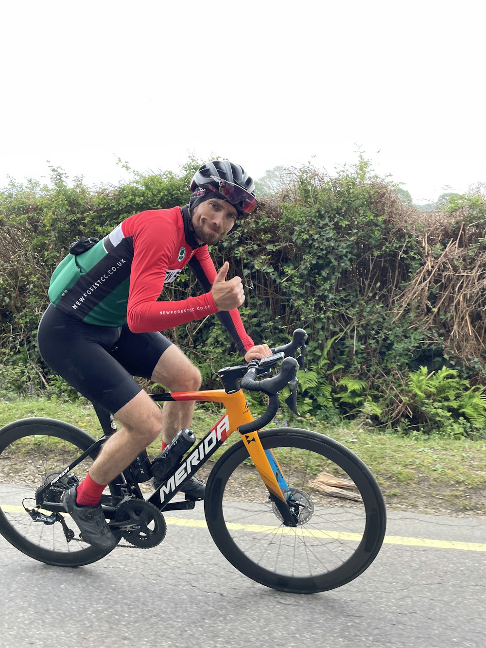 a person riding on the back of a bicycle