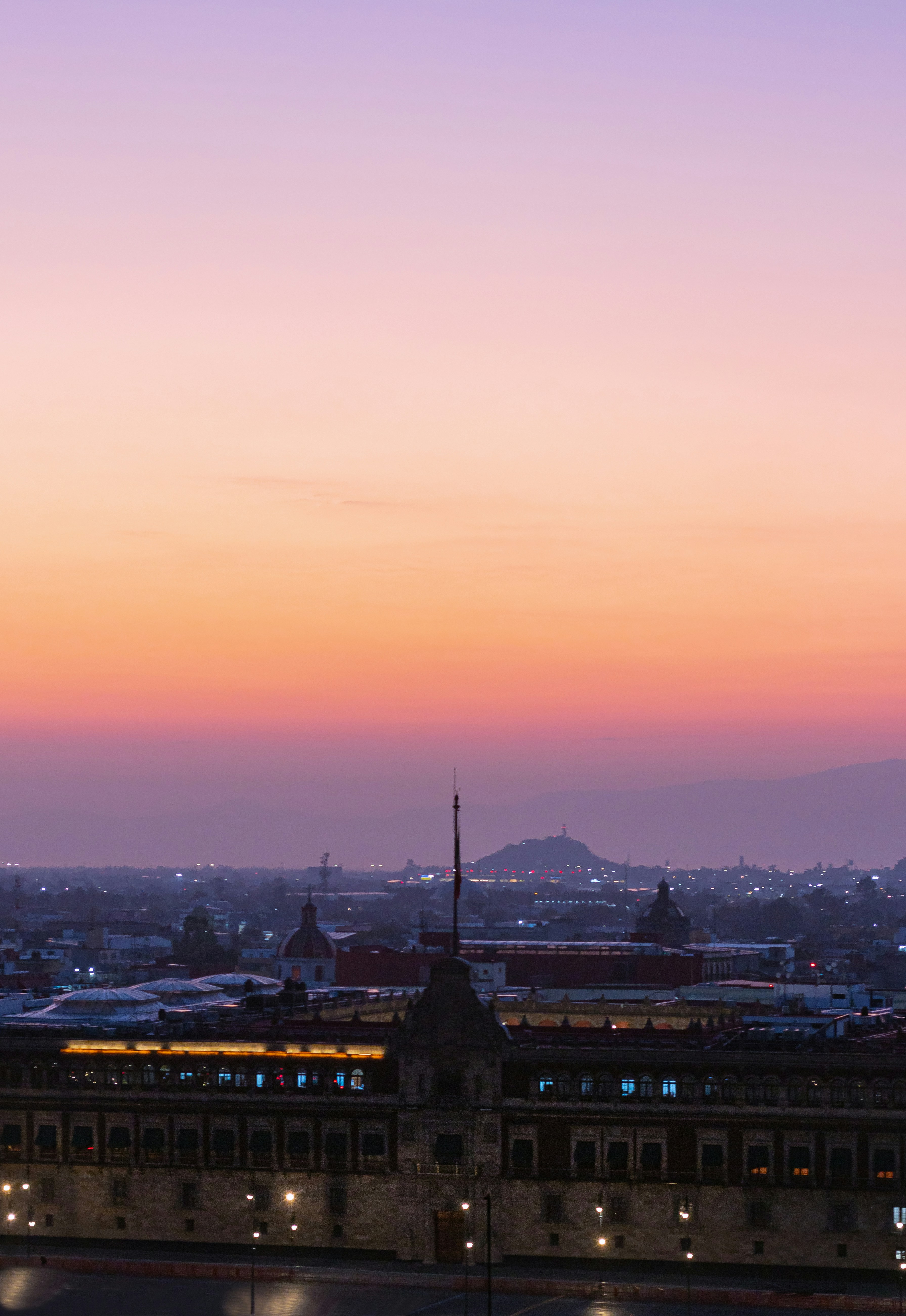 a building with a mountain in the background