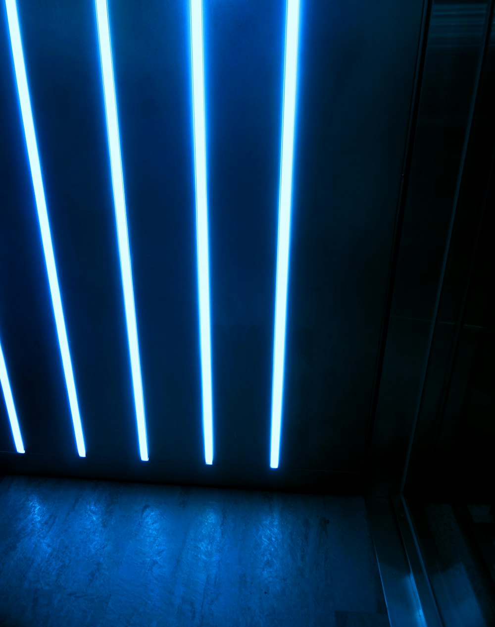 a blue light in a dark room
