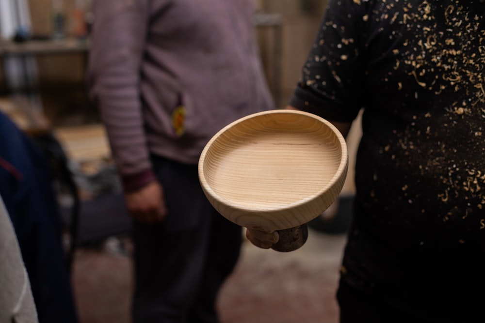 a person holding a drum