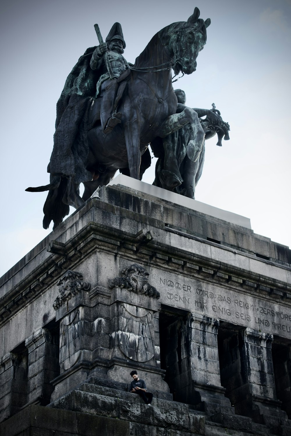 a statue of a person riding a horse